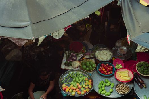 A bustling street market in Ho Chi Minh City featuring fresh produce and vibrant daily life.