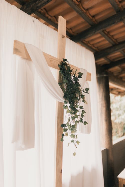 Free Beautiful cross decoration with drapery and greenery at a wedding ceremony. Stock Photo