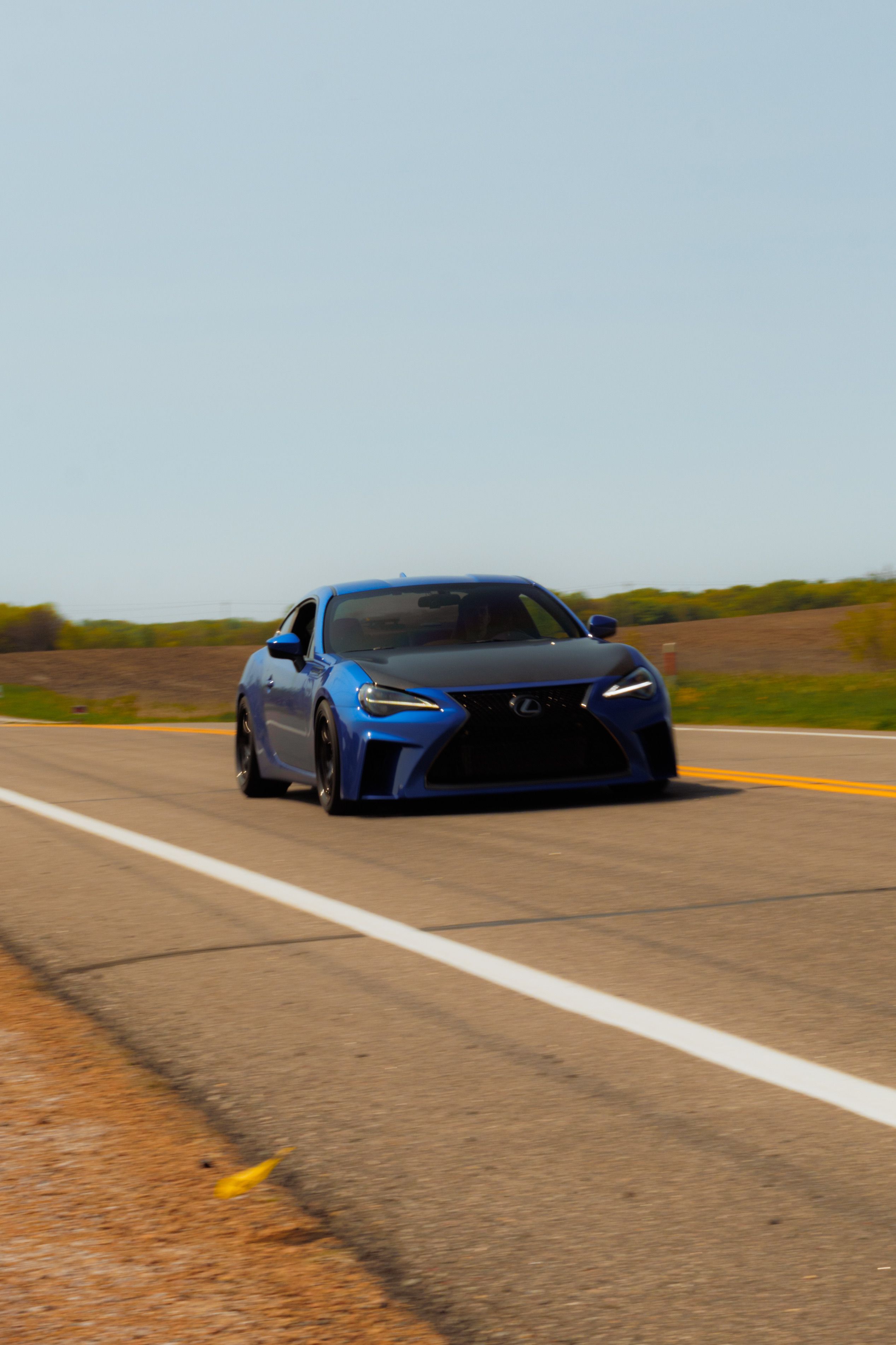 Sports Blue Car Driving on Road · Free Stock Photo