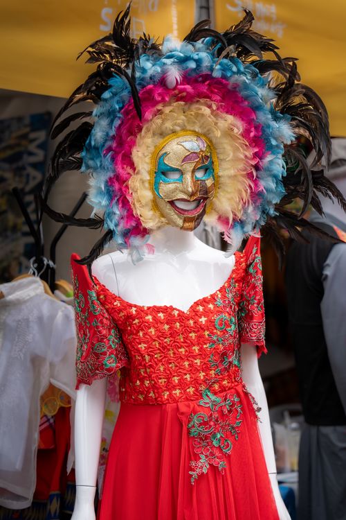 Free Colorful carnival mask on a mannequin wearing a red embroidered dress in Seoul, South Korea. Stock Photo