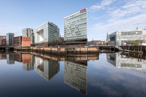 Free Stunning view of modern buildings reflecting on the water in Hamburg, Germany. Stock Photo
