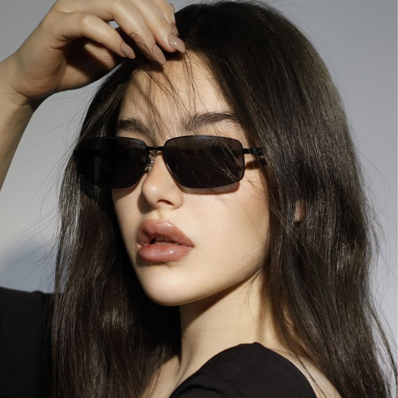 Model wearing rectangular acetate sunglasses — photo by GlassesShop GS on Pexels