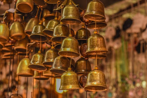 Close-Up Photo of Brass Bells