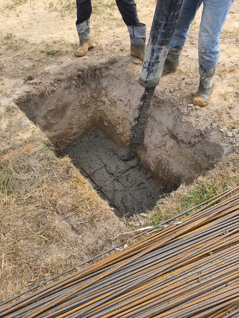 A detailed view of concrete pouring at a construction site in Miedniewice-Topola, Poland.