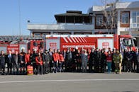 Batman Firefighters and Firetrucks Standing on Street