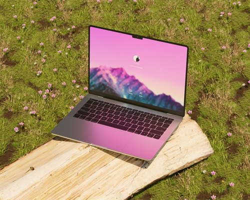 Free A stylish laptop with a pink screen sits on a wooden log amidst a green meadow with wildflowers. Stock Photo