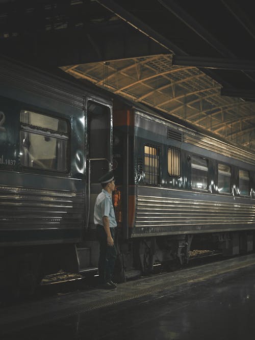 Train Personnel Standing Beside Train