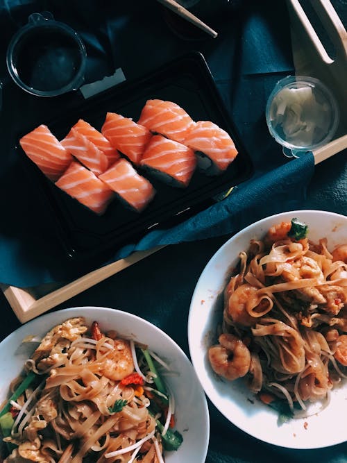 Free Top View Photo of Sushi and Cooked Noodles Stock Photo