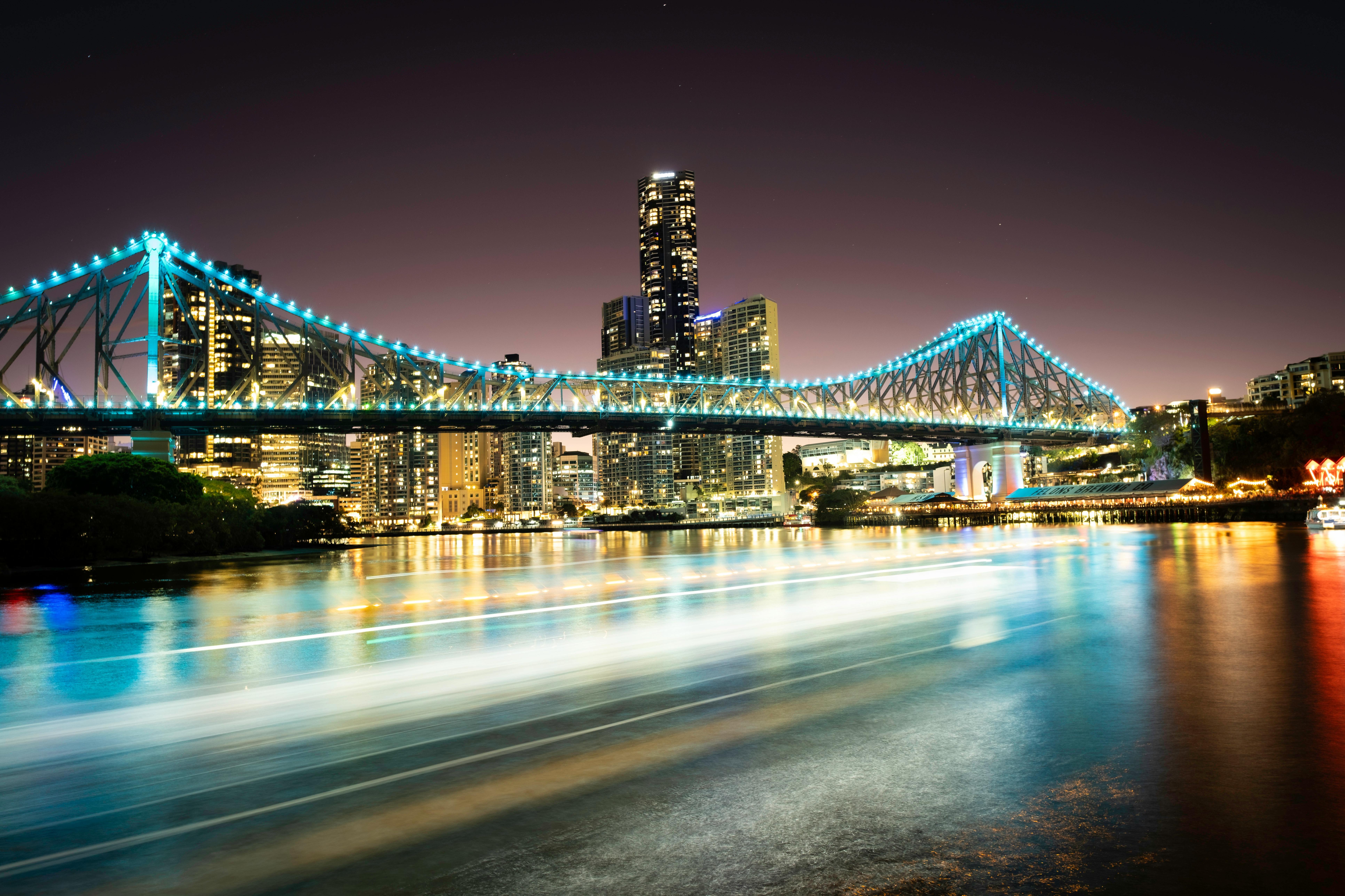 a long exposure photograph of a bridge over the river