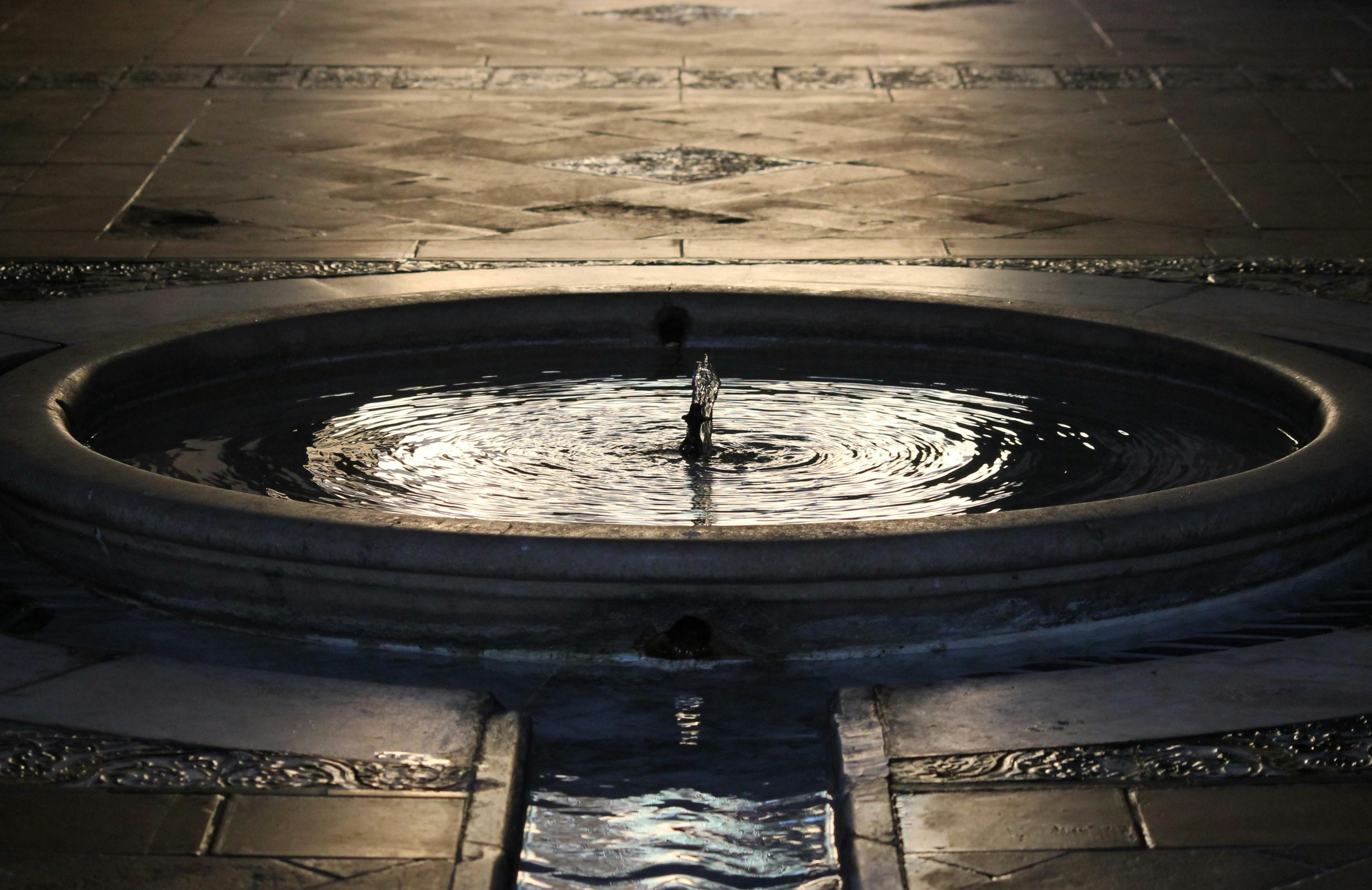 Royalty-Free photo: Concrete water fountain during daytime