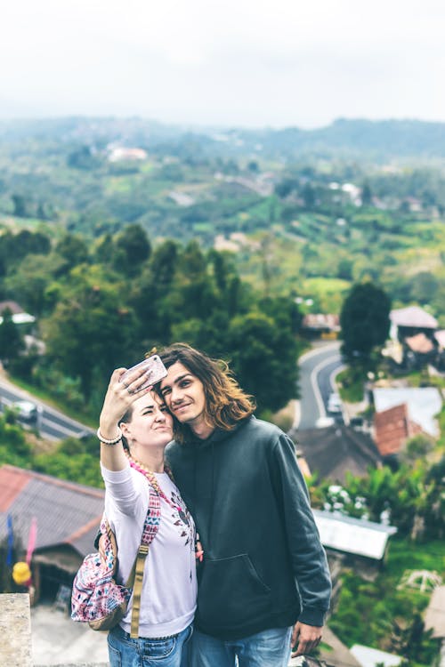 Free Man and Woman Taking Photo Stock Photo