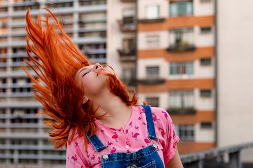 Free Portrait of a woman whipping her hair Stock Photo