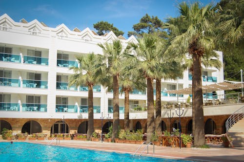 White 3-storey Building Surrounded With Trees