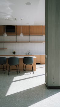 A bright and airy modern kitchen featuring sleek design elements and natural light.