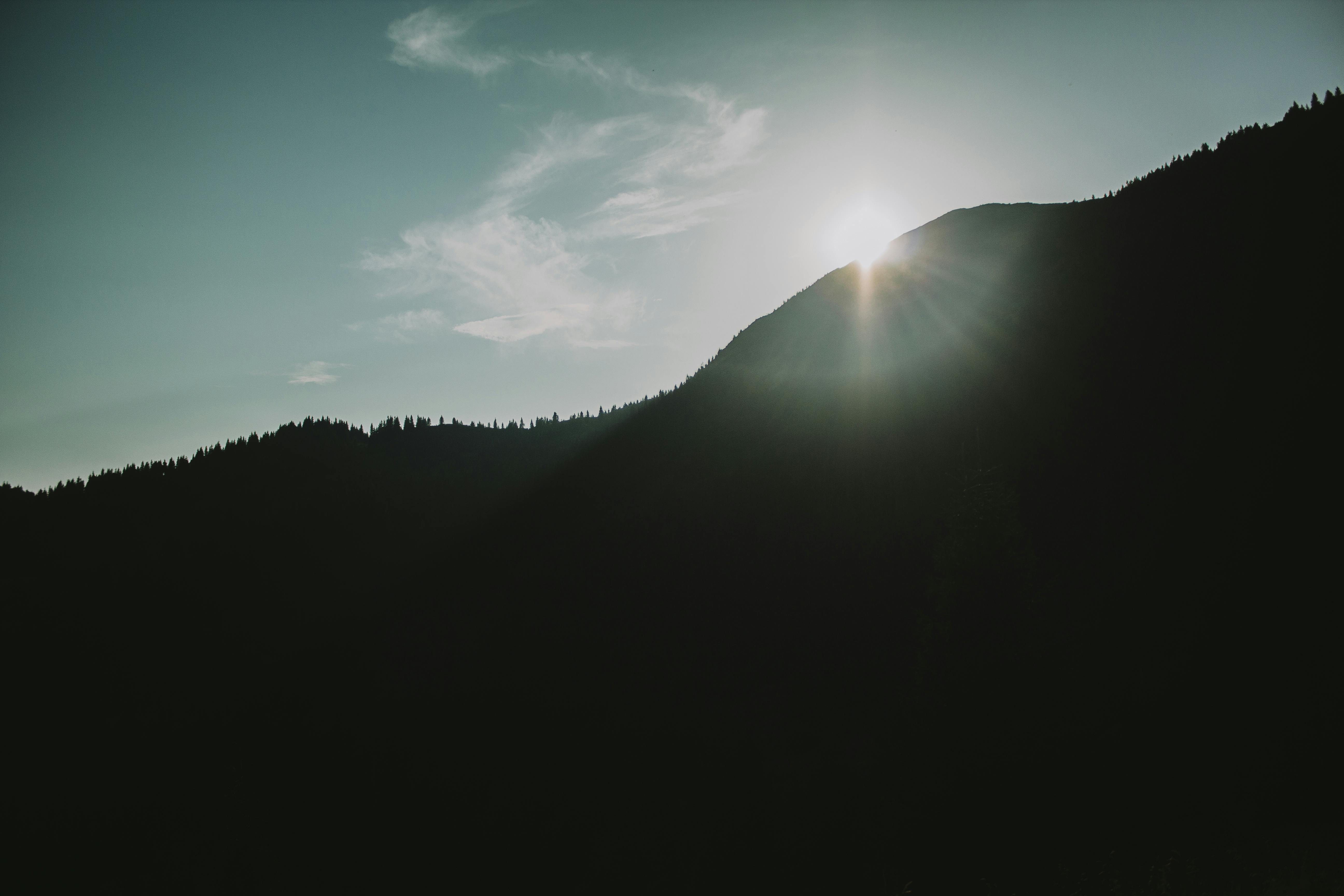 Serene view of sunset over Carpathian Mountains in Ukraine, capturing nature's beauty.