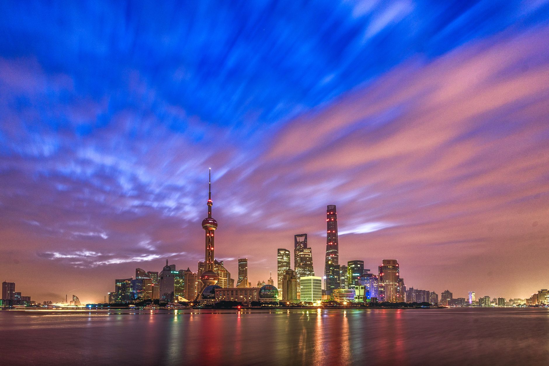 Stunning view of Shanghai skyline at twilight with vibrant skies and modern architecture.