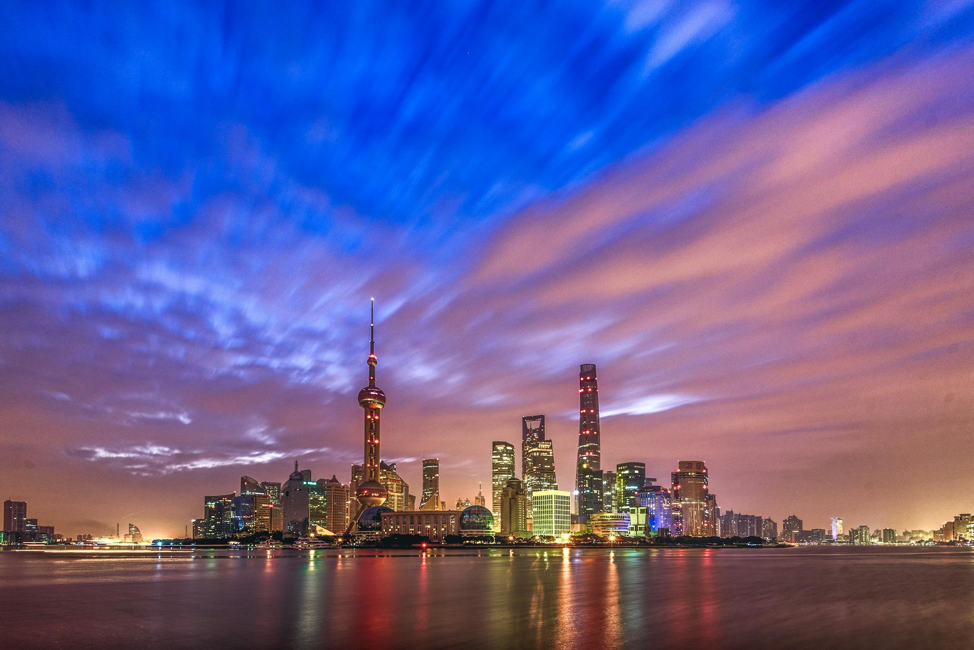 Stunning view of Shanghai skyline at twilight with vibrant skies and modern architecture.