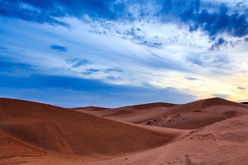 Free Brown Desert Under the Blue Skies Stock Photo