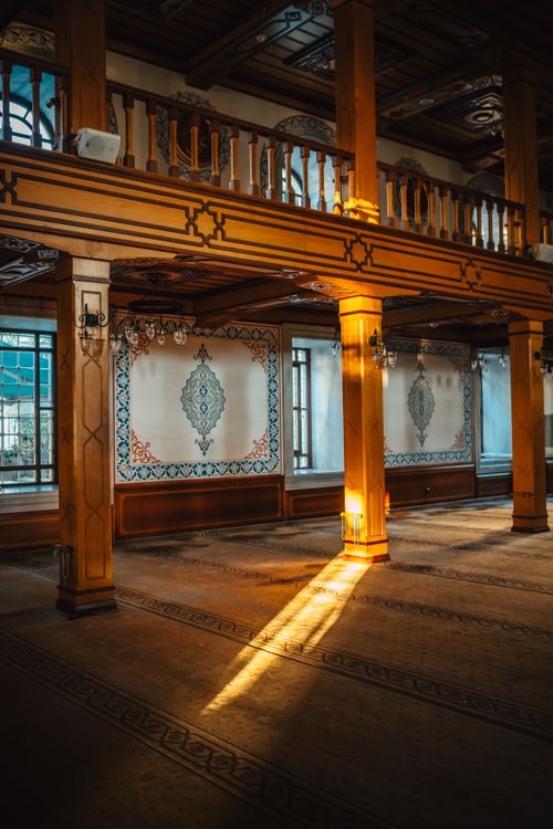 Free Beautifully lit interior of Serbostani Mustafa Aga Mosque with ornate designs and sunlight streaming through. Stock Photo