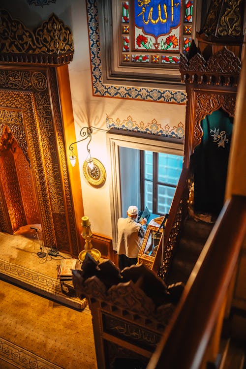 A view of a staircase with a window and a man