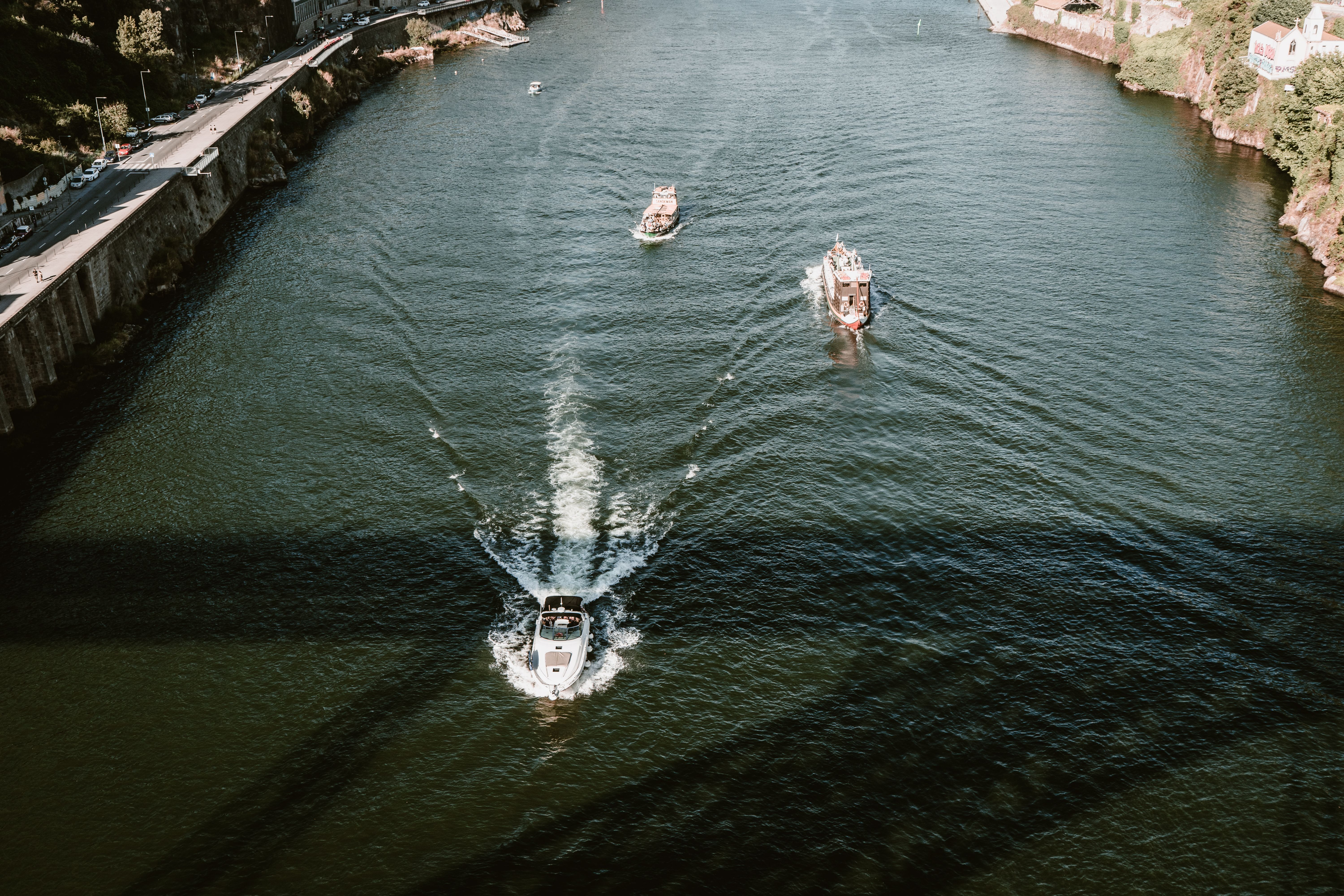 Aerial View of Boats Crossing the River · Free Stock Photo