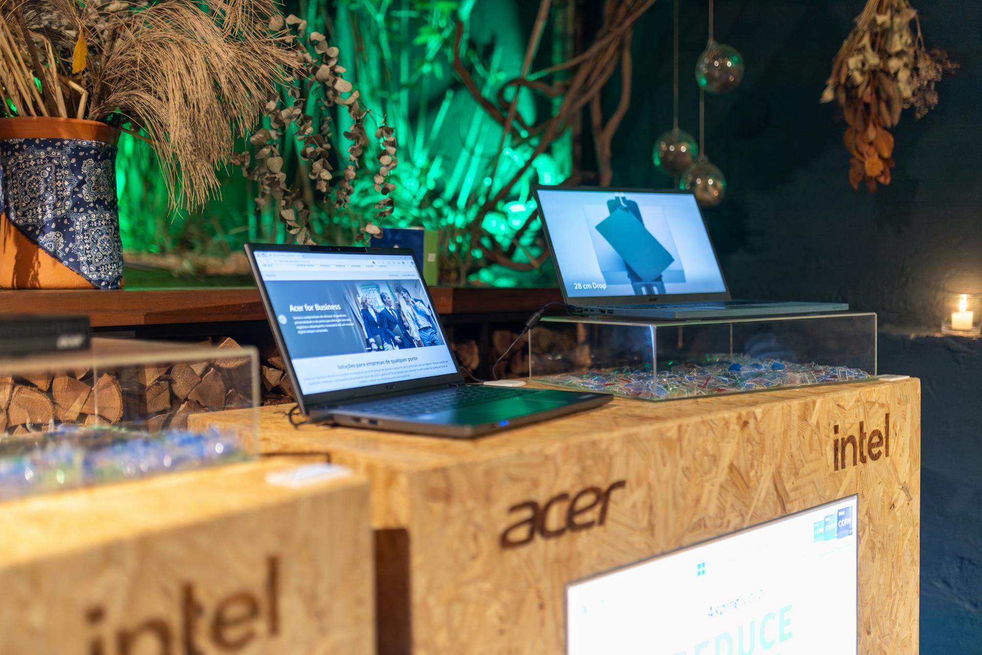 Showcasing Acer laptops with Intel processors at a contemporary tech event.