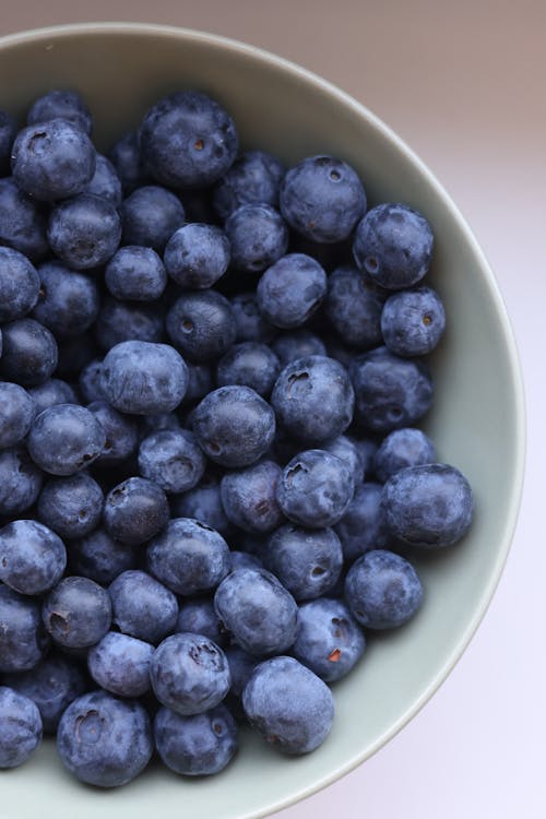Blueberries in a bowl on a white table