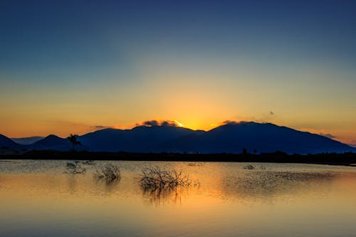 Free Silhouette of Mountain during Golden Hour Stock Photo