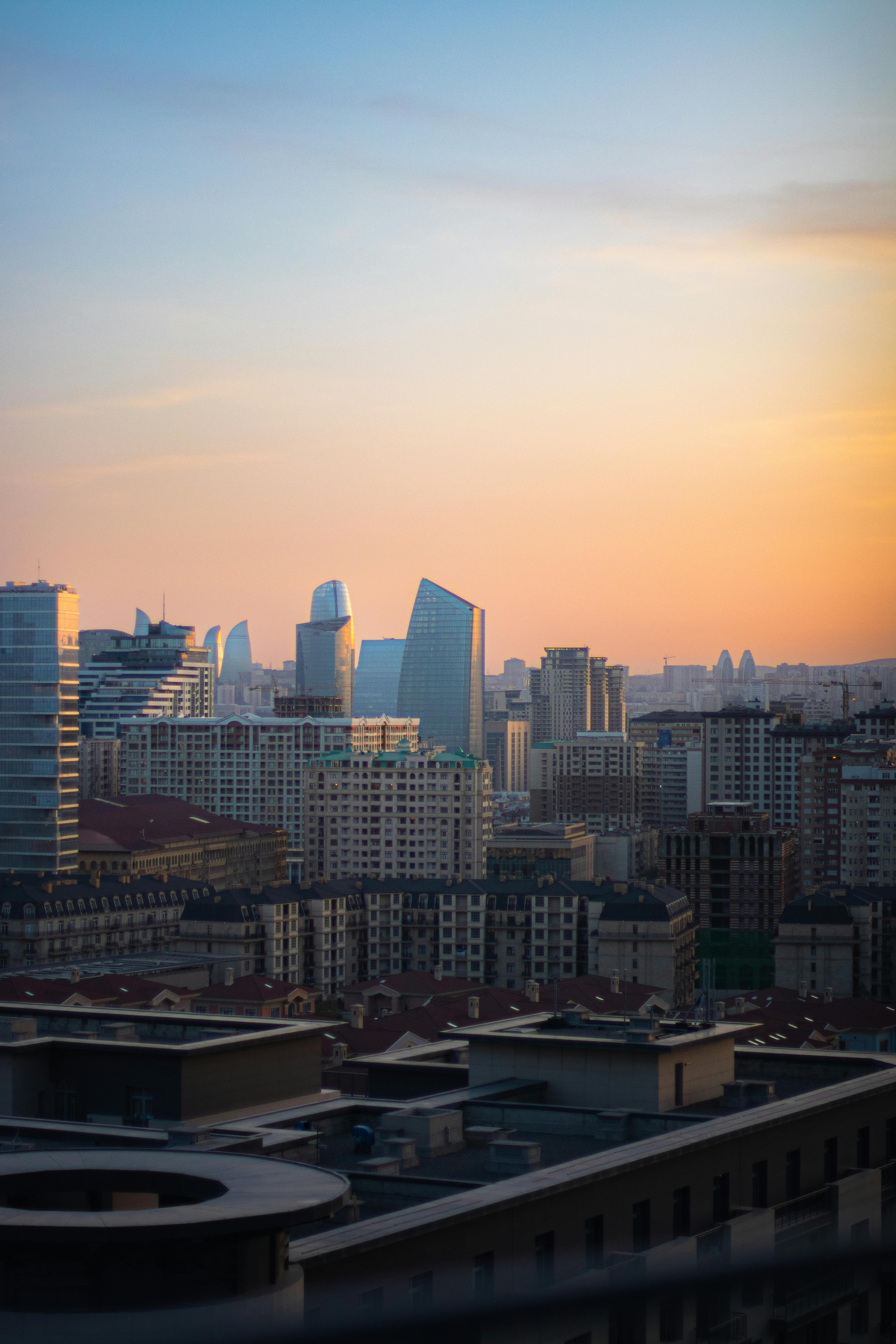 Captivating urban skyline with modern skyscrapers at dusk, showcasing architectural diversity.