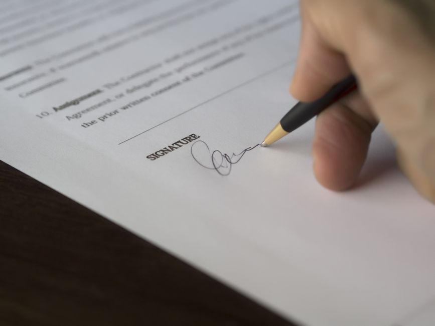 Business contract and pricing document on desk