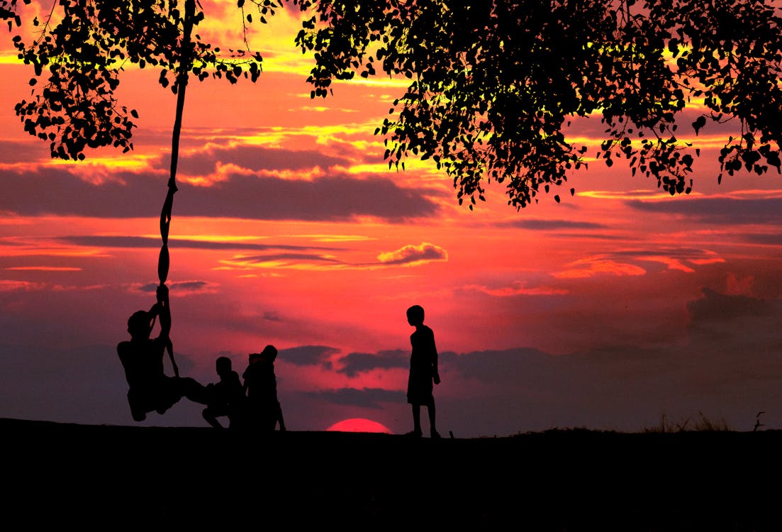 Silhouette Photo of Children Playing