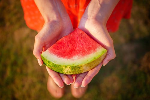 Free Close-up Photography of Red Watermelon Fruit on Human Palm Stock Photo