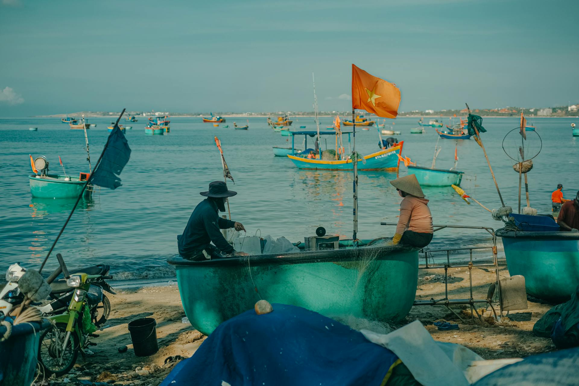 Fishermen in traditional basket boats work on the coast of Phan Thiet, Vietnam.