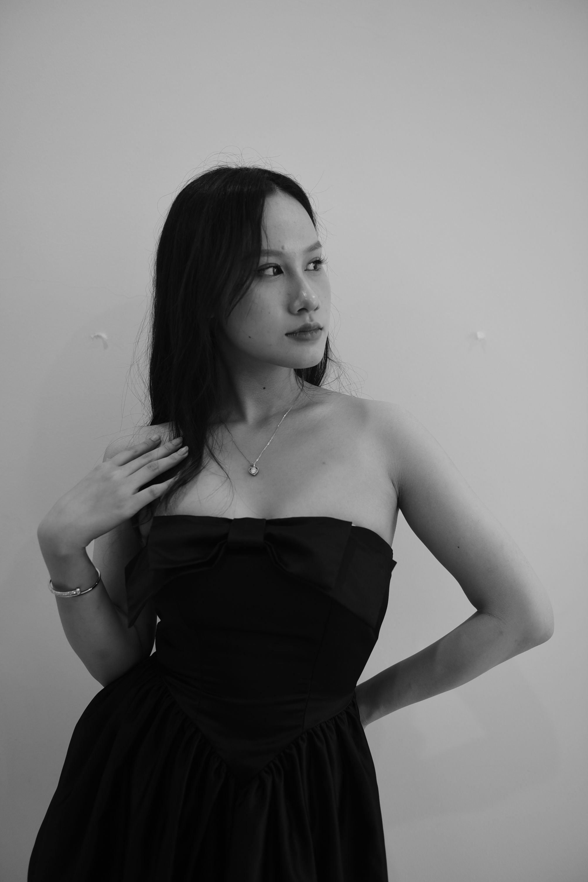 A Woman Posing in a Black Dress · Free Stock Photo