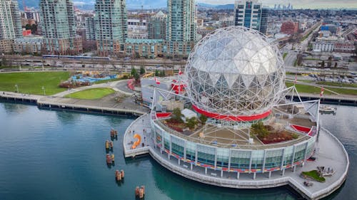 Science World in Vancouver surround by turquoise water of False Creek