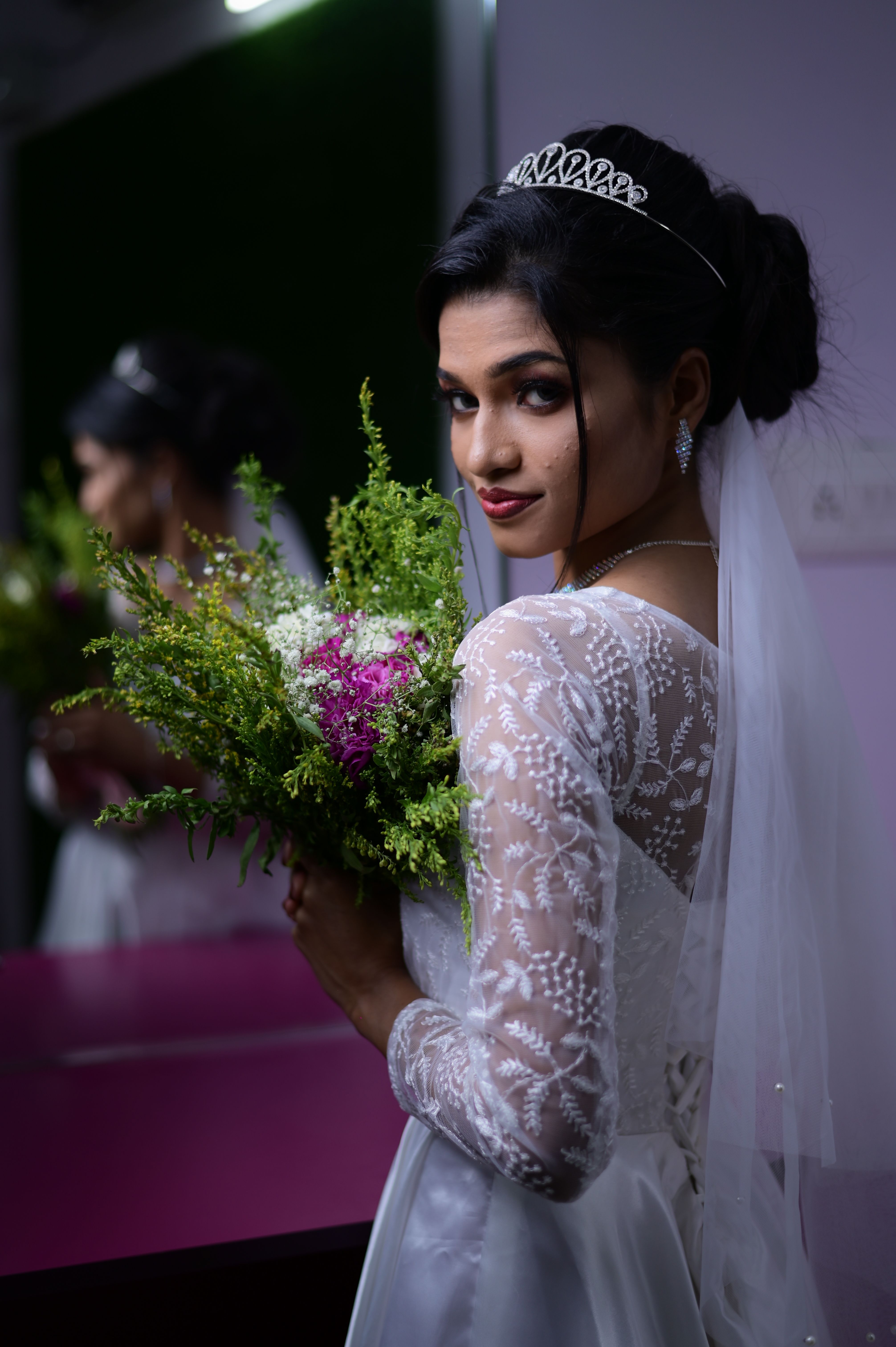 Stunning portrait of a bride holding a bouquet, showcasing elegance and beauty.