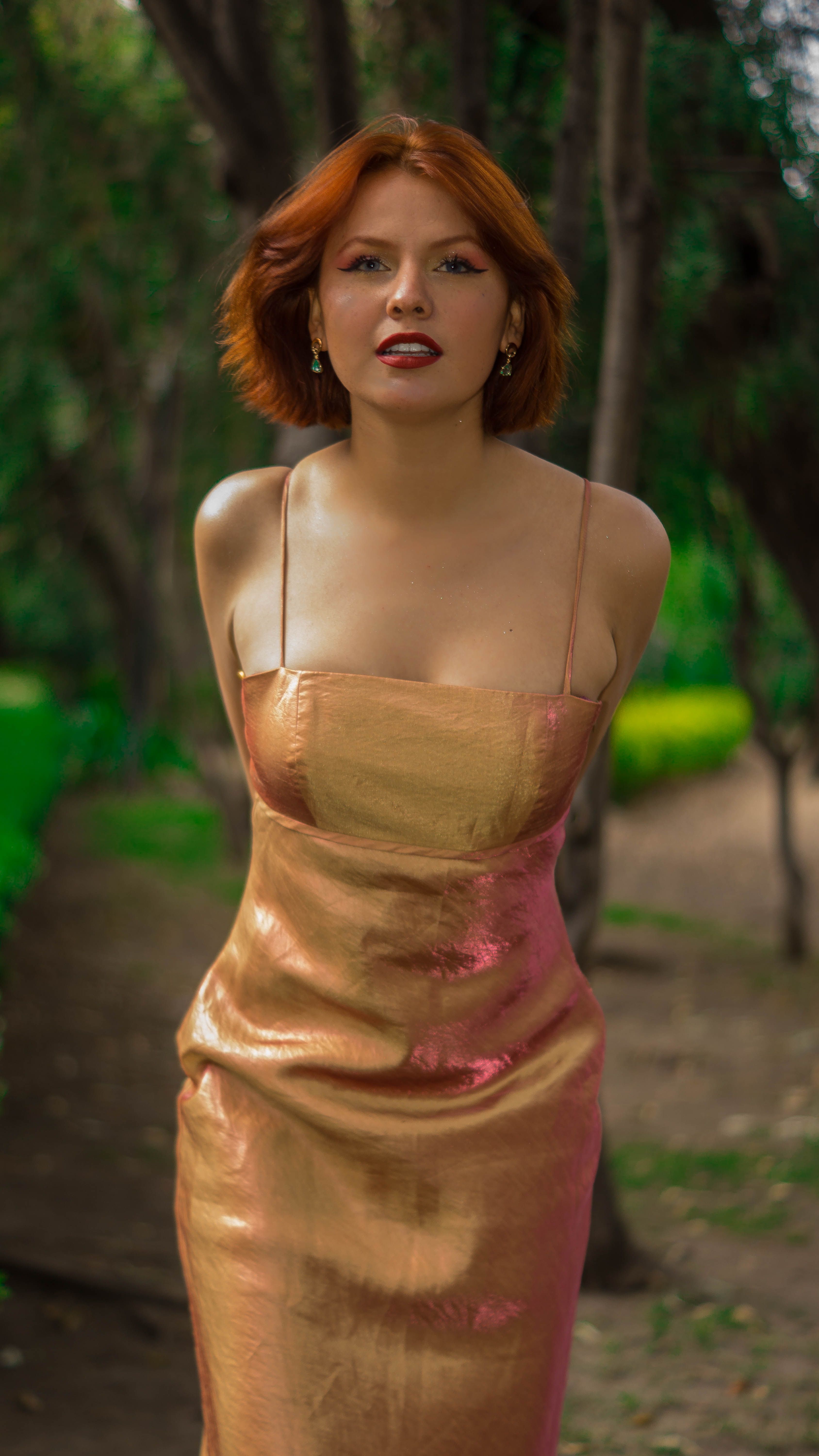 Redhead Model in Golden Dress  Free Stock Photo