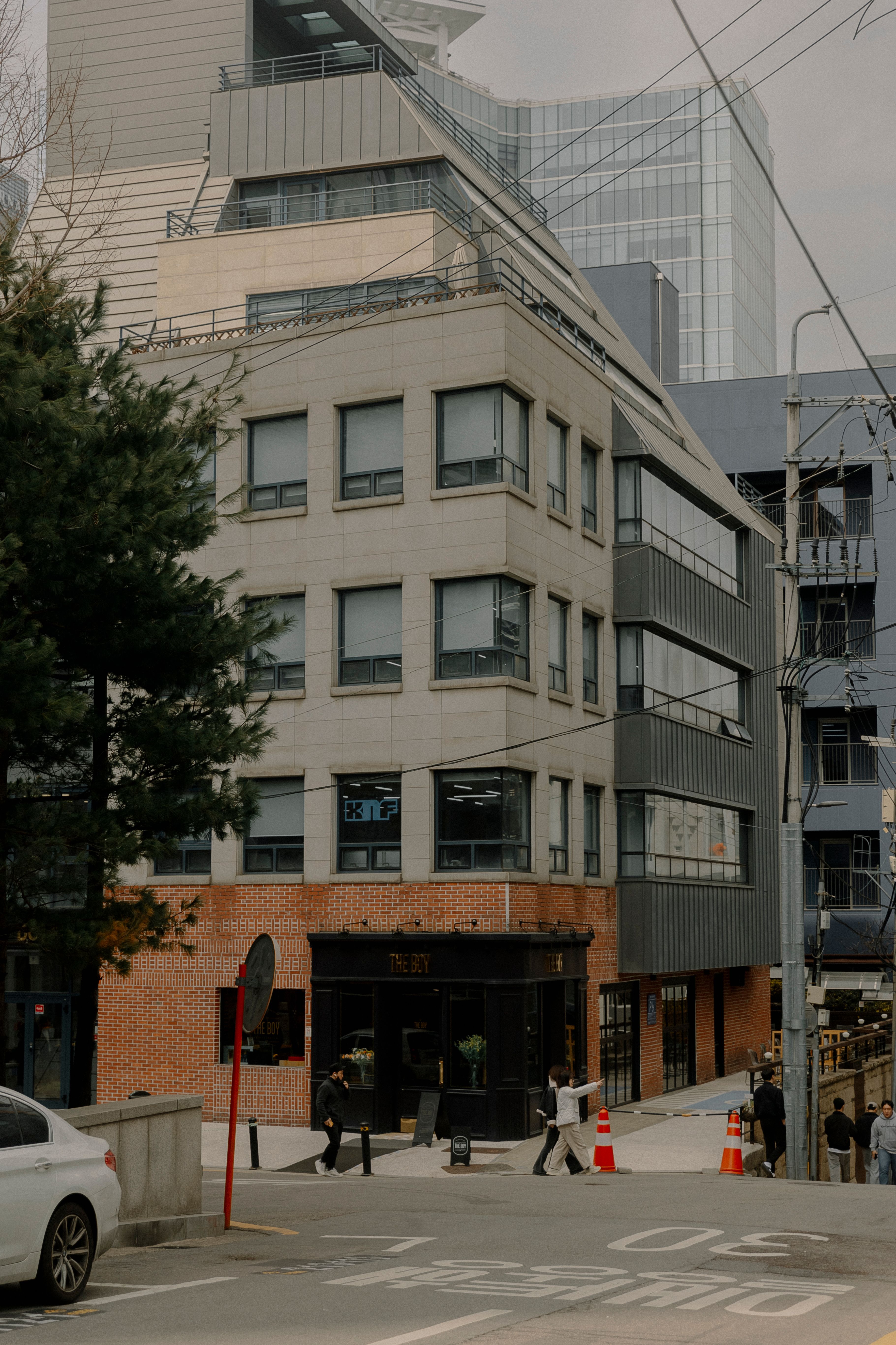 people walking past a residential building