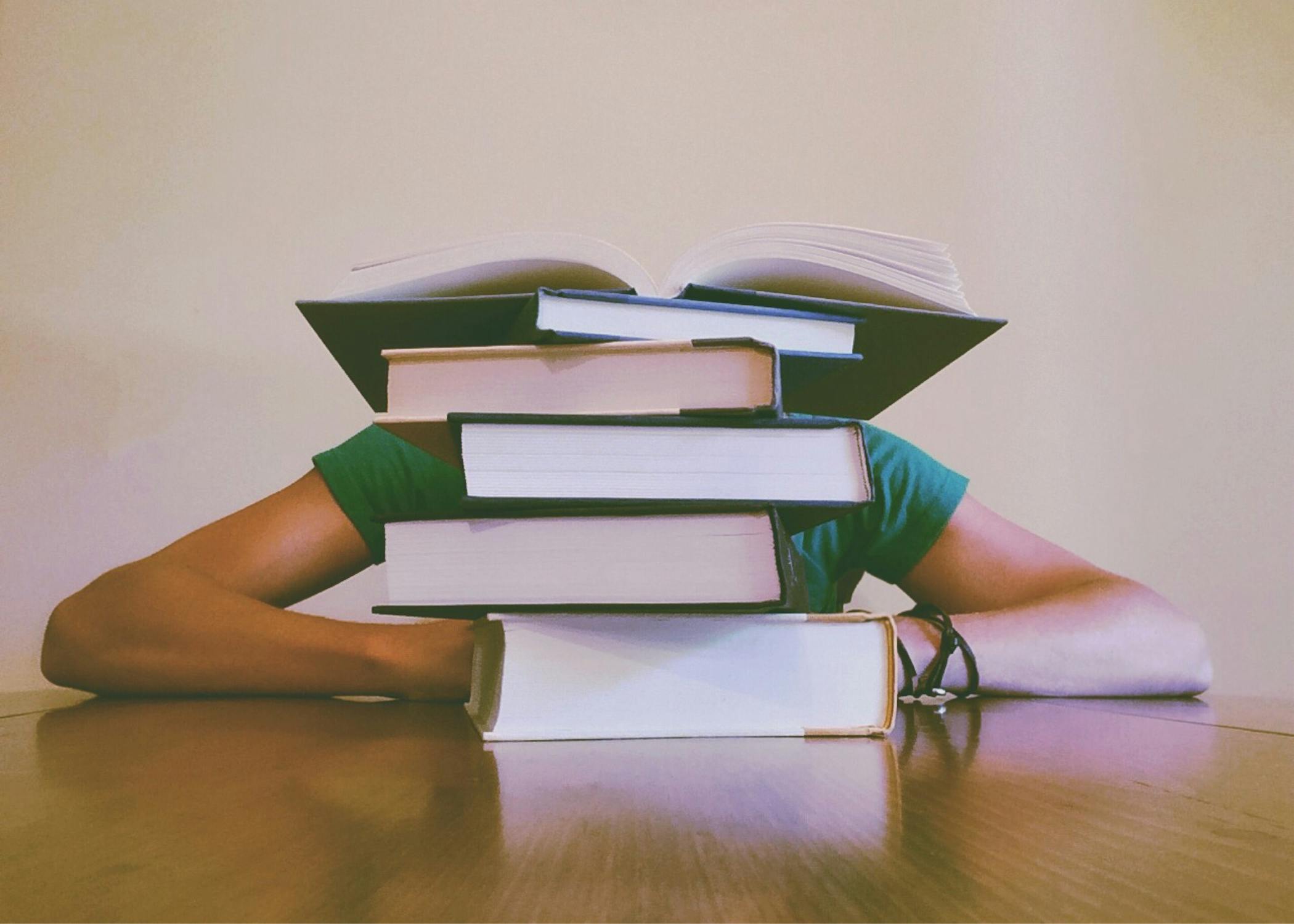 Behind stack of books