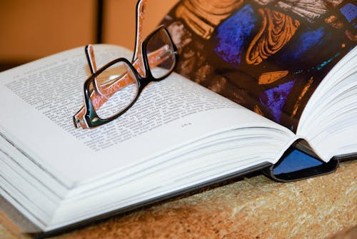 Eyeglasses on Open Book