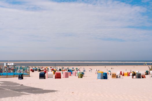 Colorful beach huts on Borkum Island, Germany. Perfect summer vacation spot.