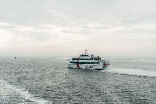 A ferry named AG EMS navigating the sea near Borkum in Germany.