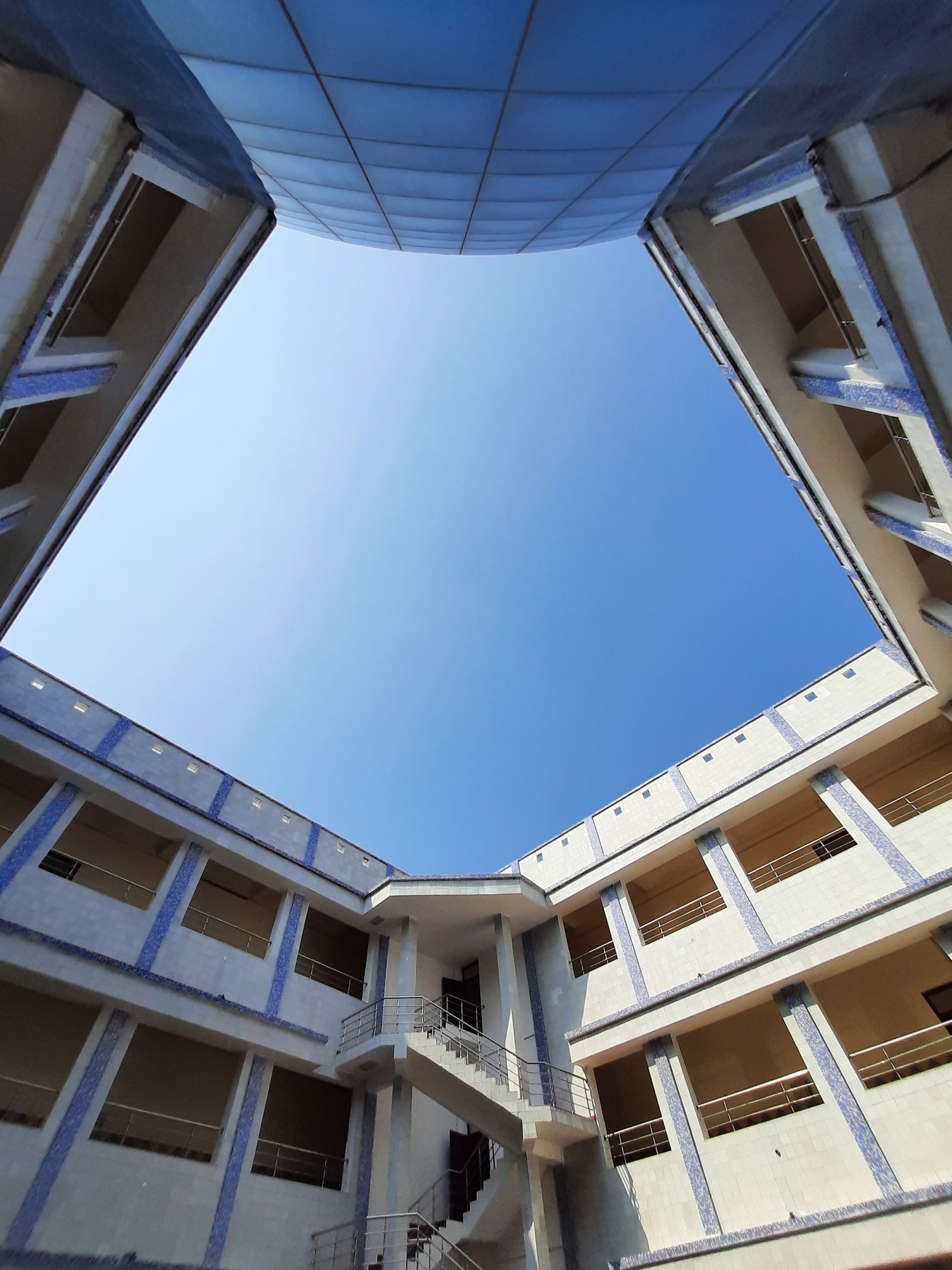 A modern academic courtyard under a clear sky