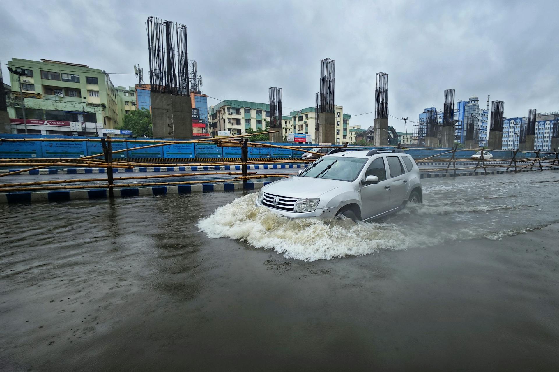 Car on Street in City during Flood