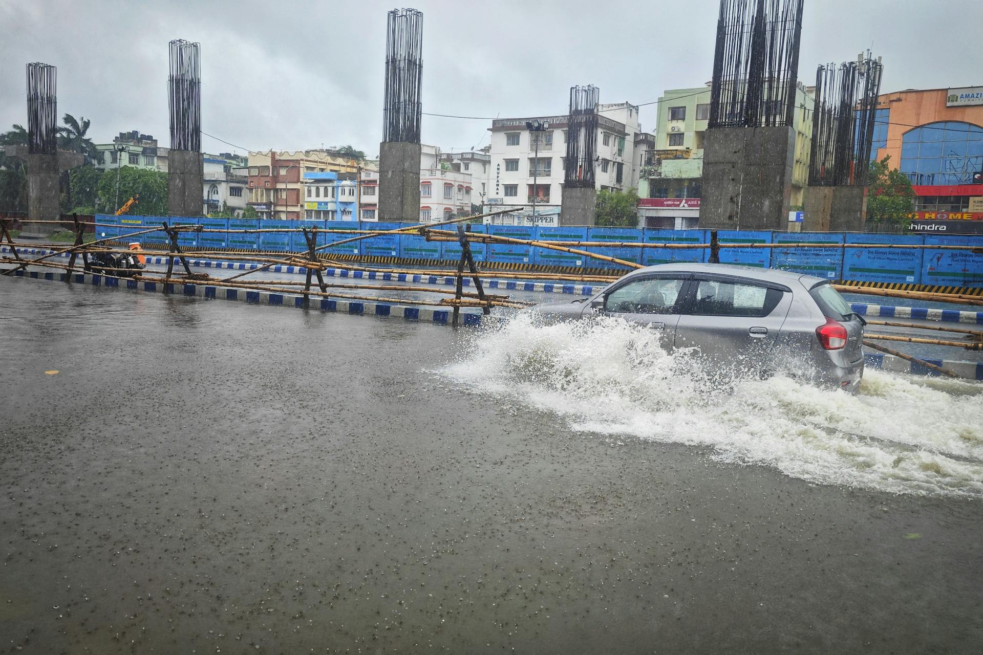 Car in Water on Street during Flood