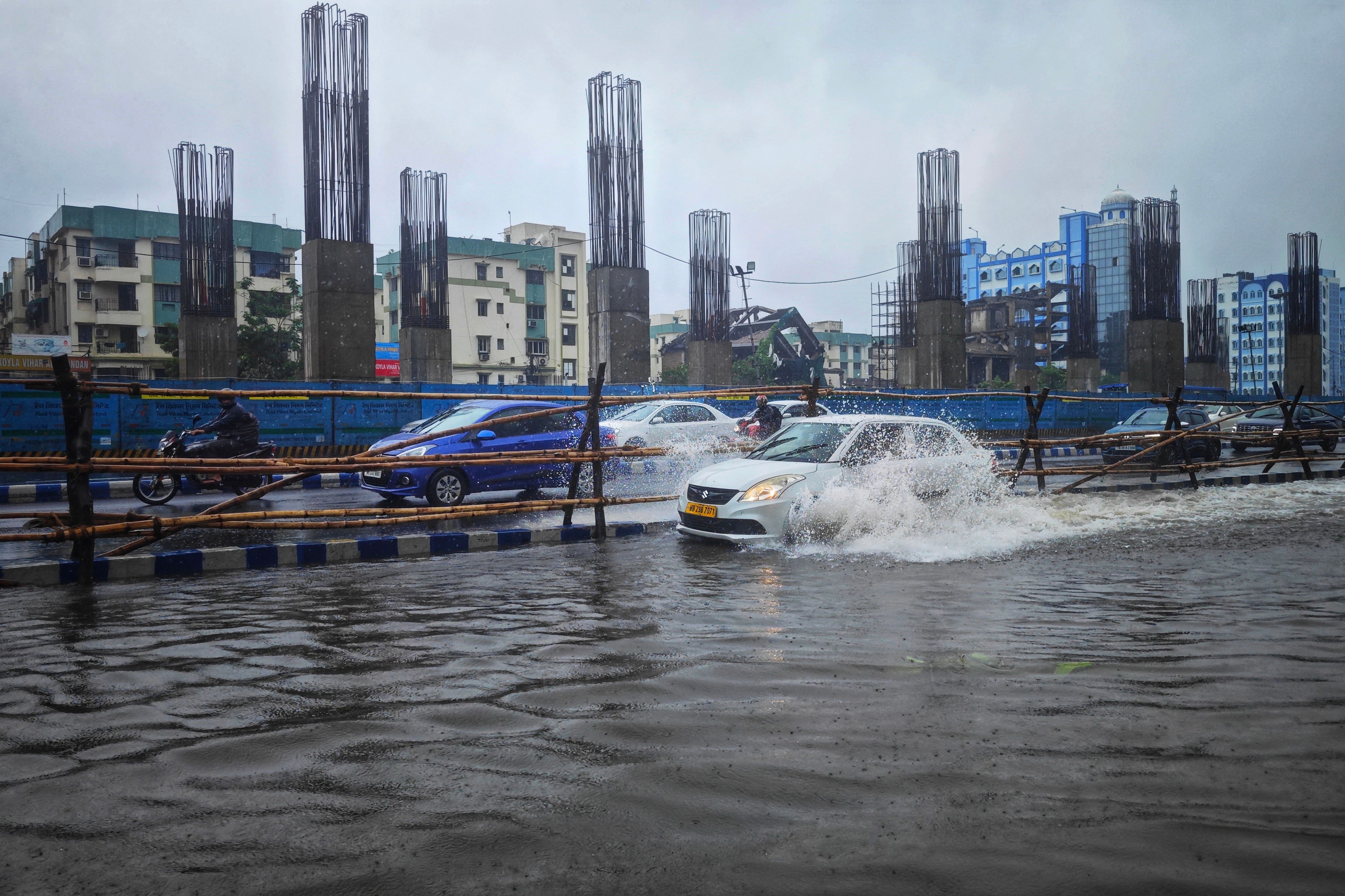 Cars Driving through a Flooded Street · Free Stock Photo
