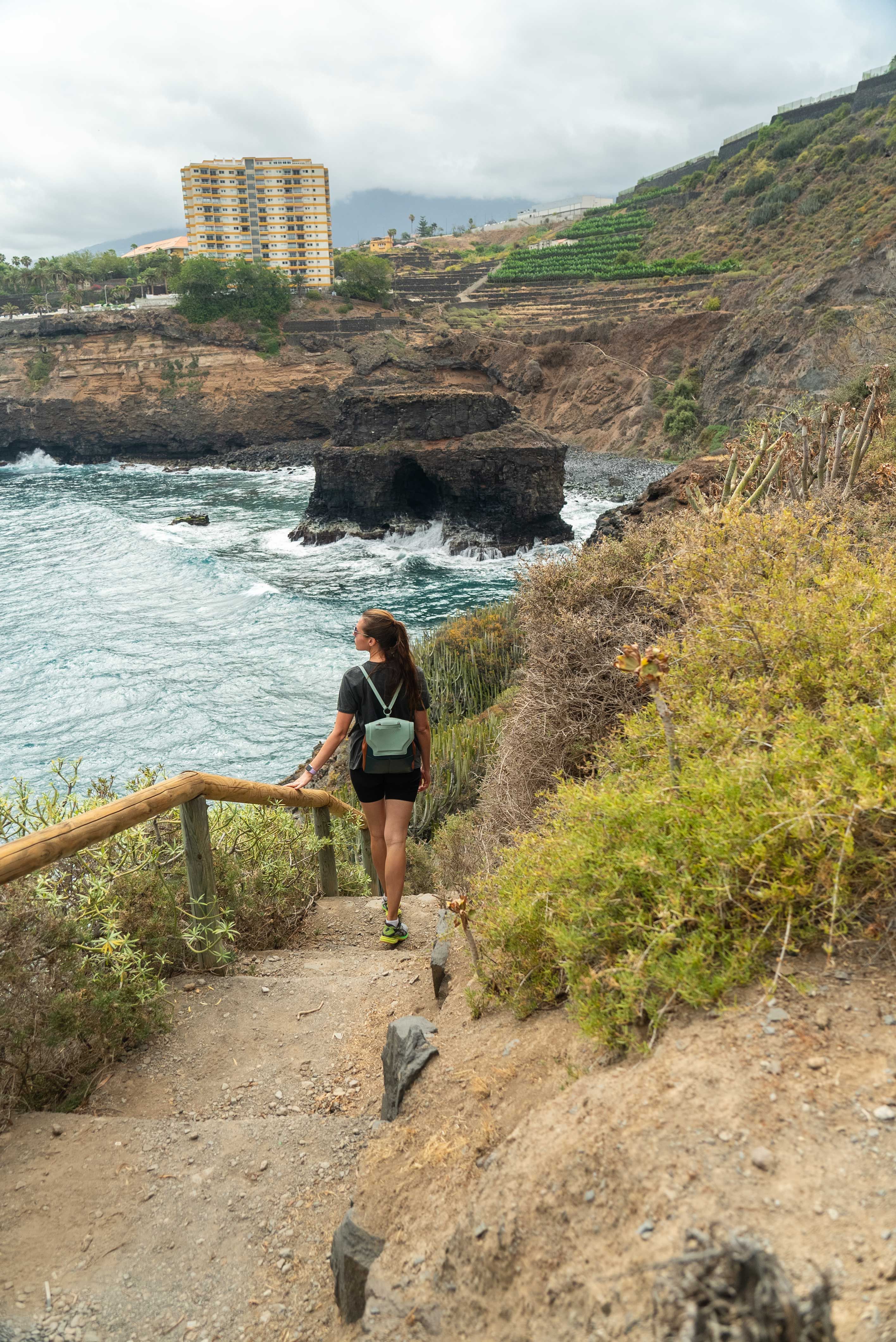 Back View of a Woman Walking on the Steps on the Shore · Free Stock Photo