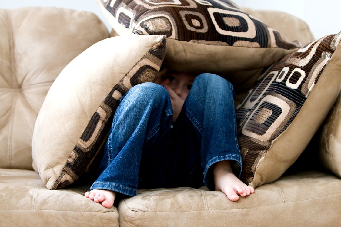 Person Sitting on Couch