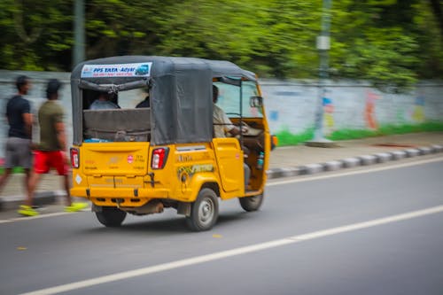 a fast moving auto rickshaw