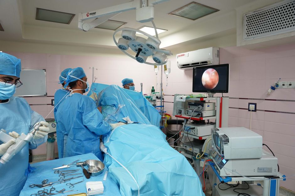 surgeon performing endoscopic thoracic surgery with instruments